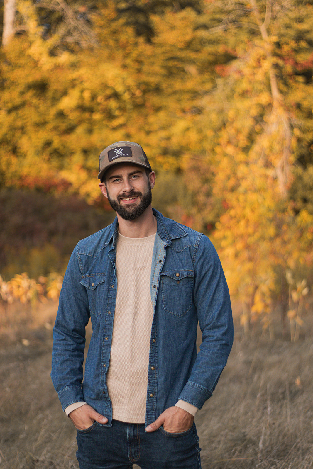 Matt Hawley, owner of M Hawley Contracting, standing outdoors in autumn
